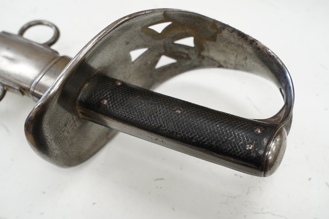 An 1893 pattern Cavalry Trooper’s sword, first issued to the 9th Lancers, and subsequently to the Derbyshire Yeomanry, in its steel scabbard, blade 86.5cm. Condition - generally good condition, some dents to scabbard